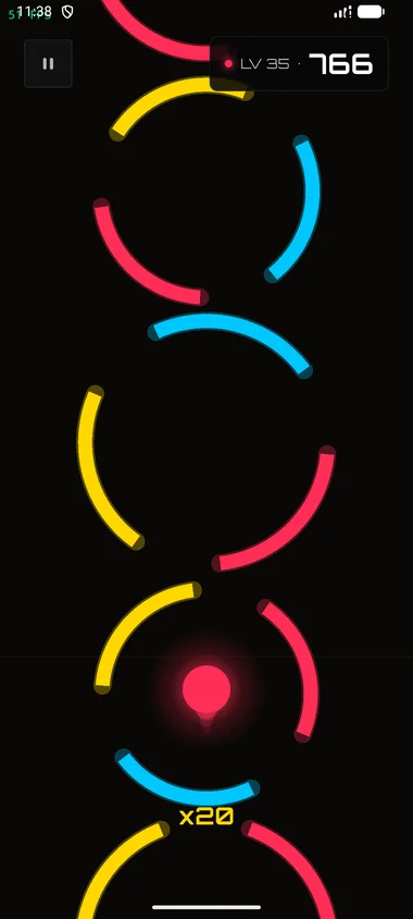 Mid-run gameplay on Level 35 with the ball rising through three concentric rings with four color segments